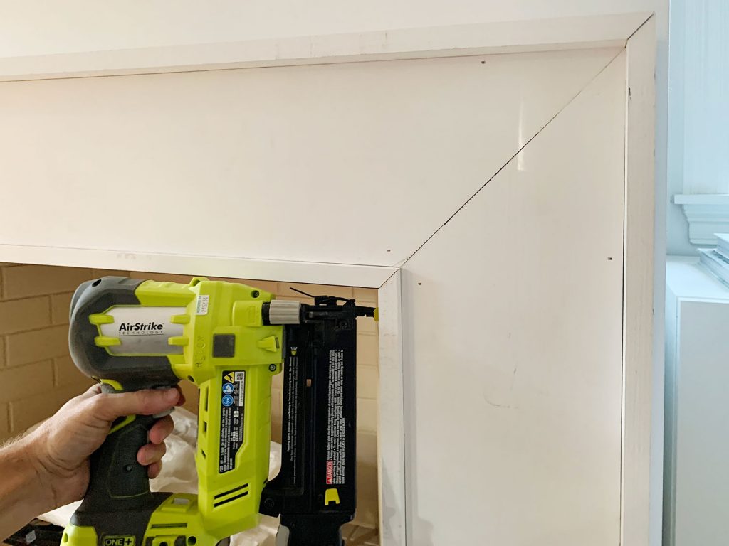 Nail Gun Securing Inner Border Pieces Around Inside Of Mantel