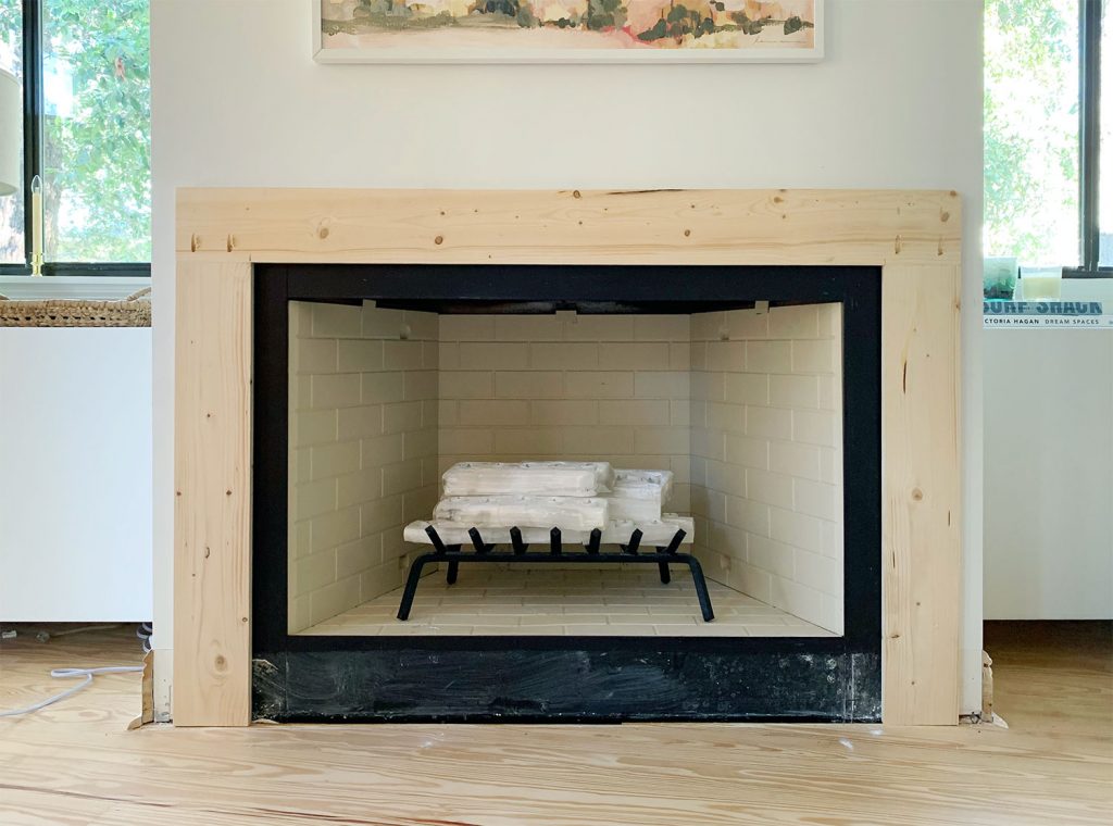 Mantel Brace Piece Made Of Raw Wood Surrounding Fireplace On 3 Sides