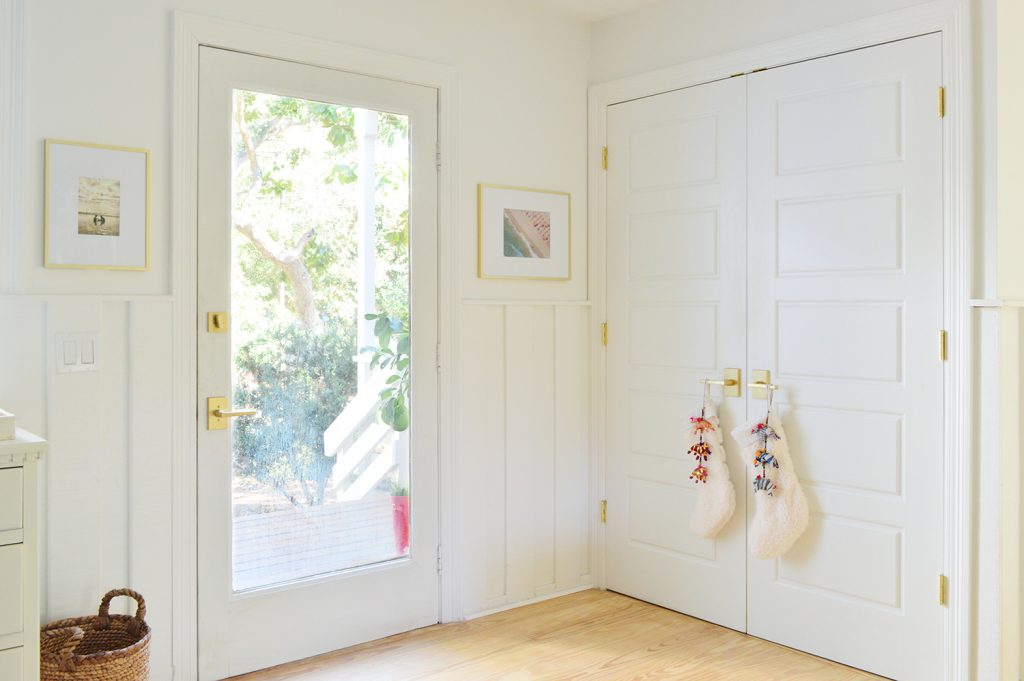 Front Door Next To Laundry Closet With Stockings On Handle