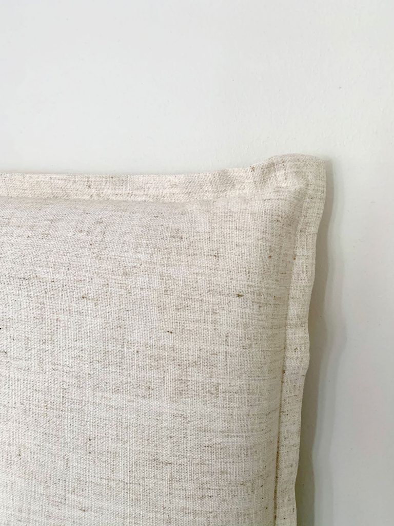 Close up detail of french seam on edge of linen headboard