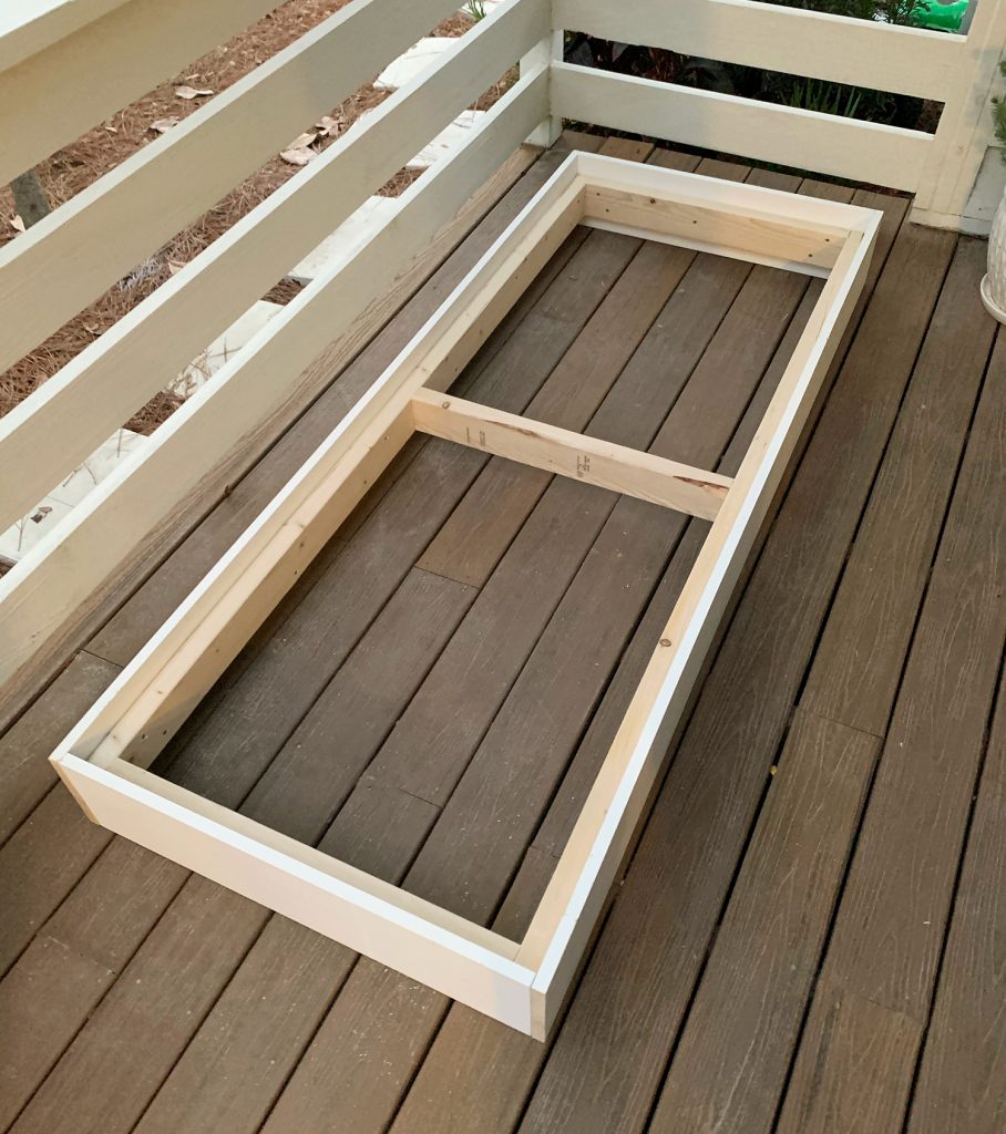 Fully constructed 2x4 platform frame with white 1x8 around outside