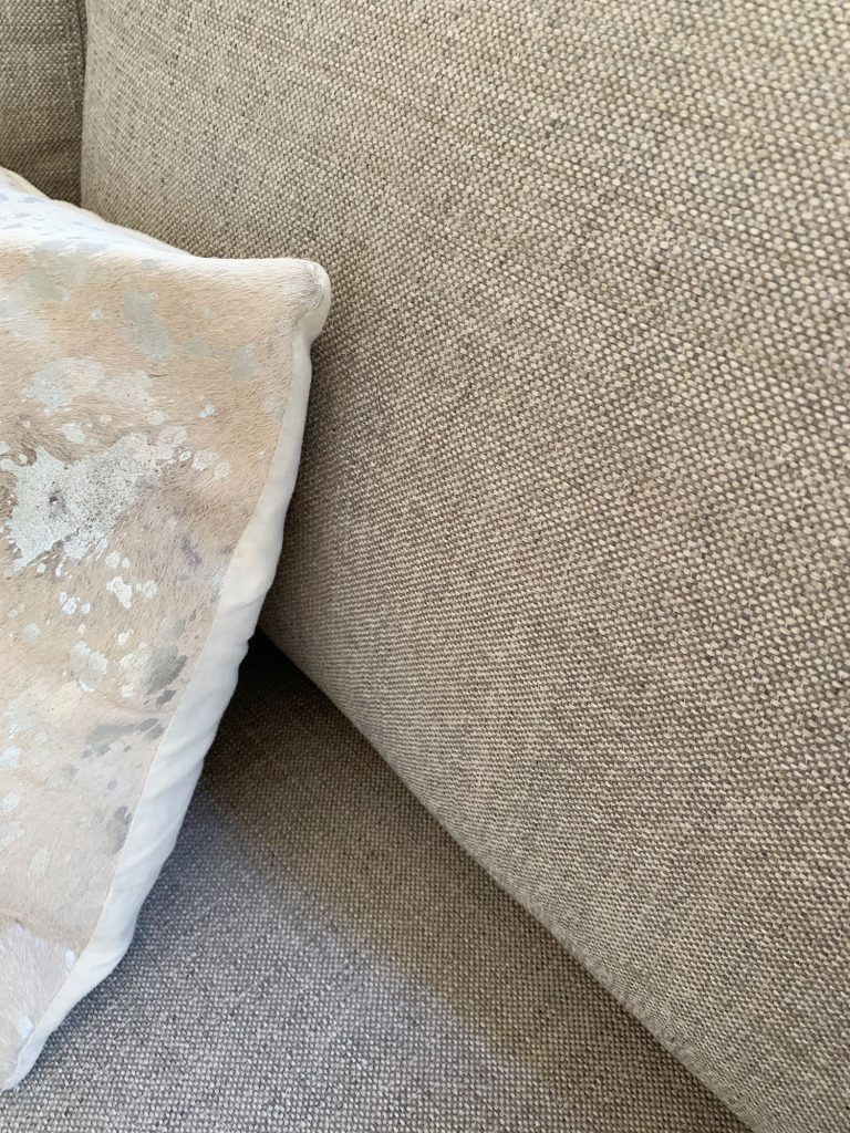 Detail of gray fabric on loveseat