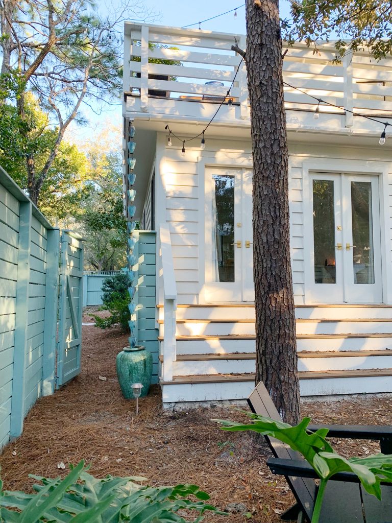 After photo of side yard area with fence gate open to front yard