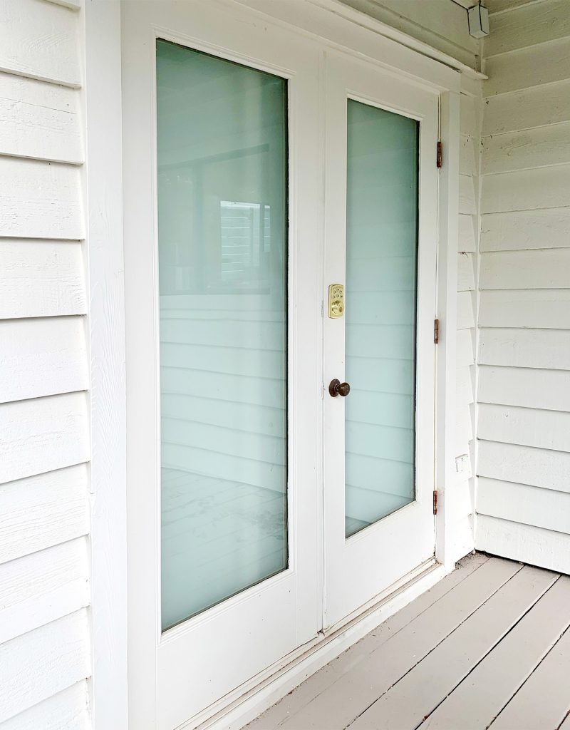 French doors viewed from outside that have been drywalled over