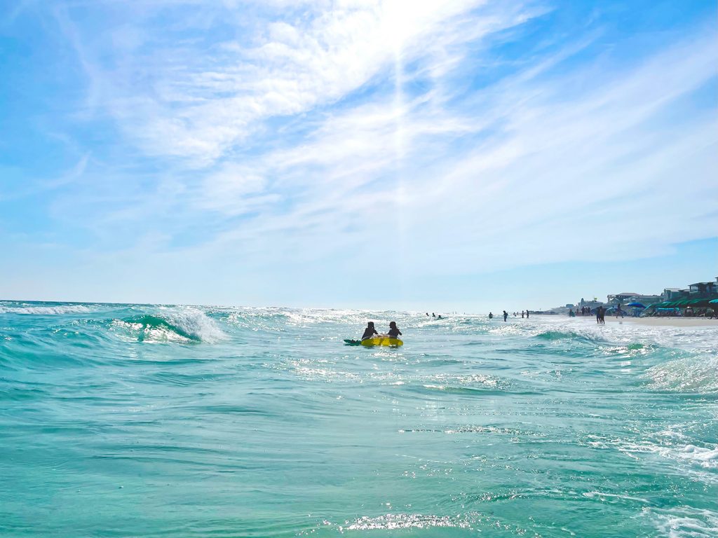 Kids Playing In Waves In The Gulf Of Mexico