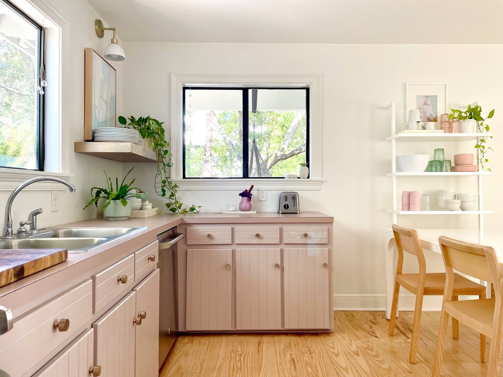 Mauve Painted Kitchen Cabinets With View Through Window And Open Shelves