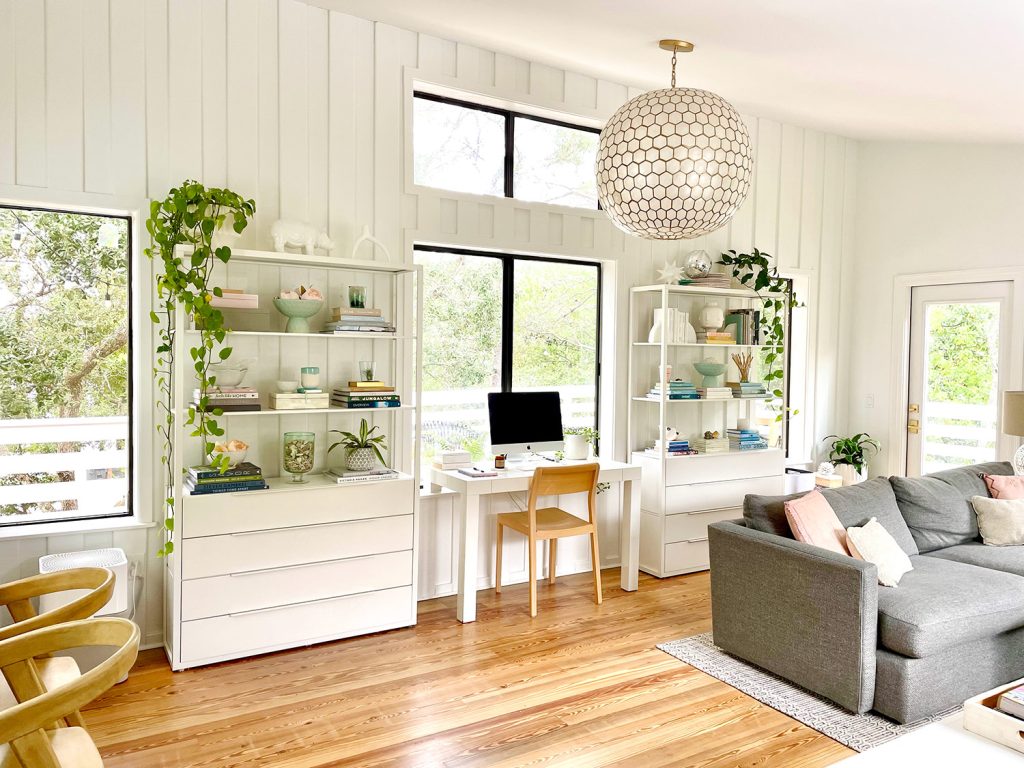 After Photo Of Modern Upstairs Family Room With White Paneled Walls And Capiz Globe Light Fixture