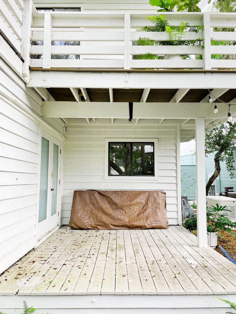 Midpoint photo of cover porch with stained painted floor and no furniture