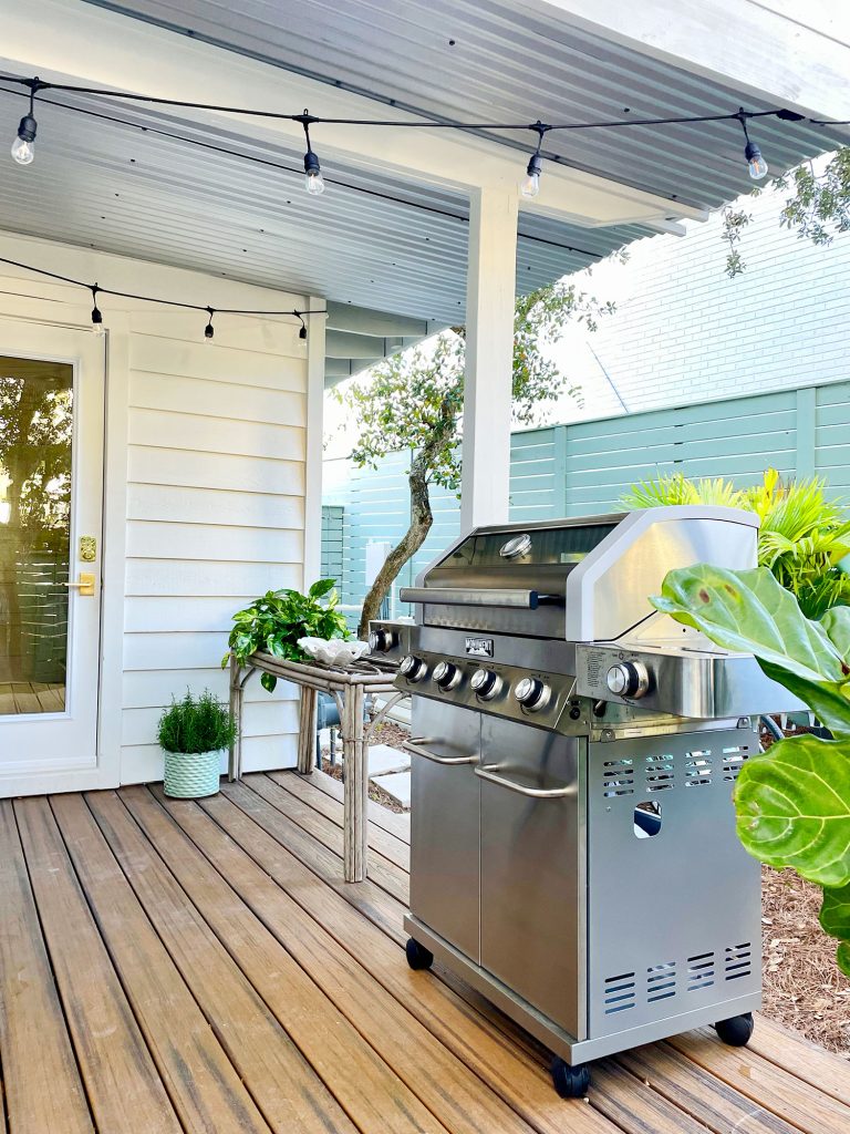Stainless steel grill on covered kitchen porch