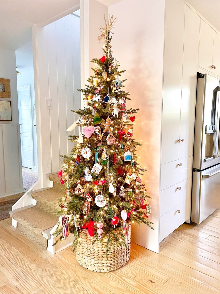 Narrow Christmas Tree in corner of kitchen next to pantry and stairs