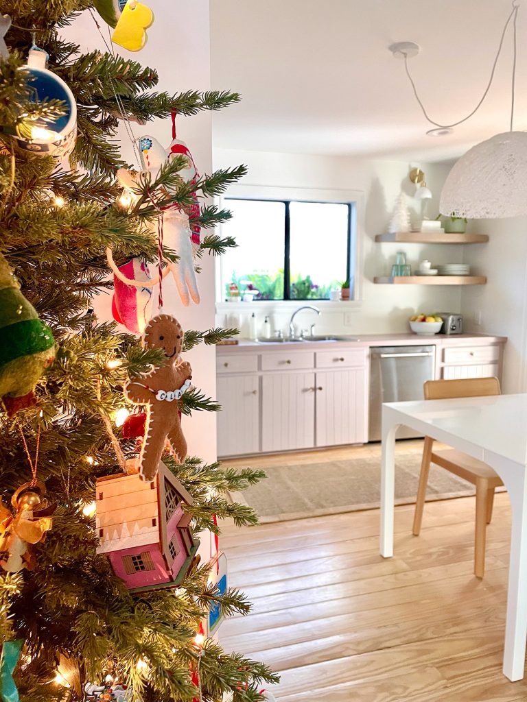 Side of Christmas tree near pantry in kitchen