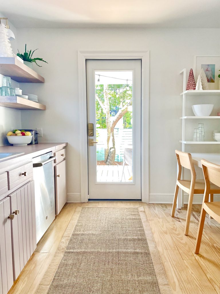 Same view of kitchen with new door added where window used to be