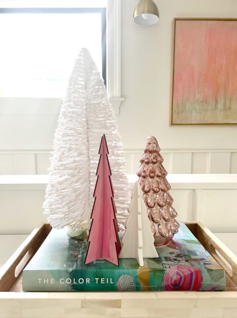 Assortment of decorative Christmas tabletop trees in pink and white