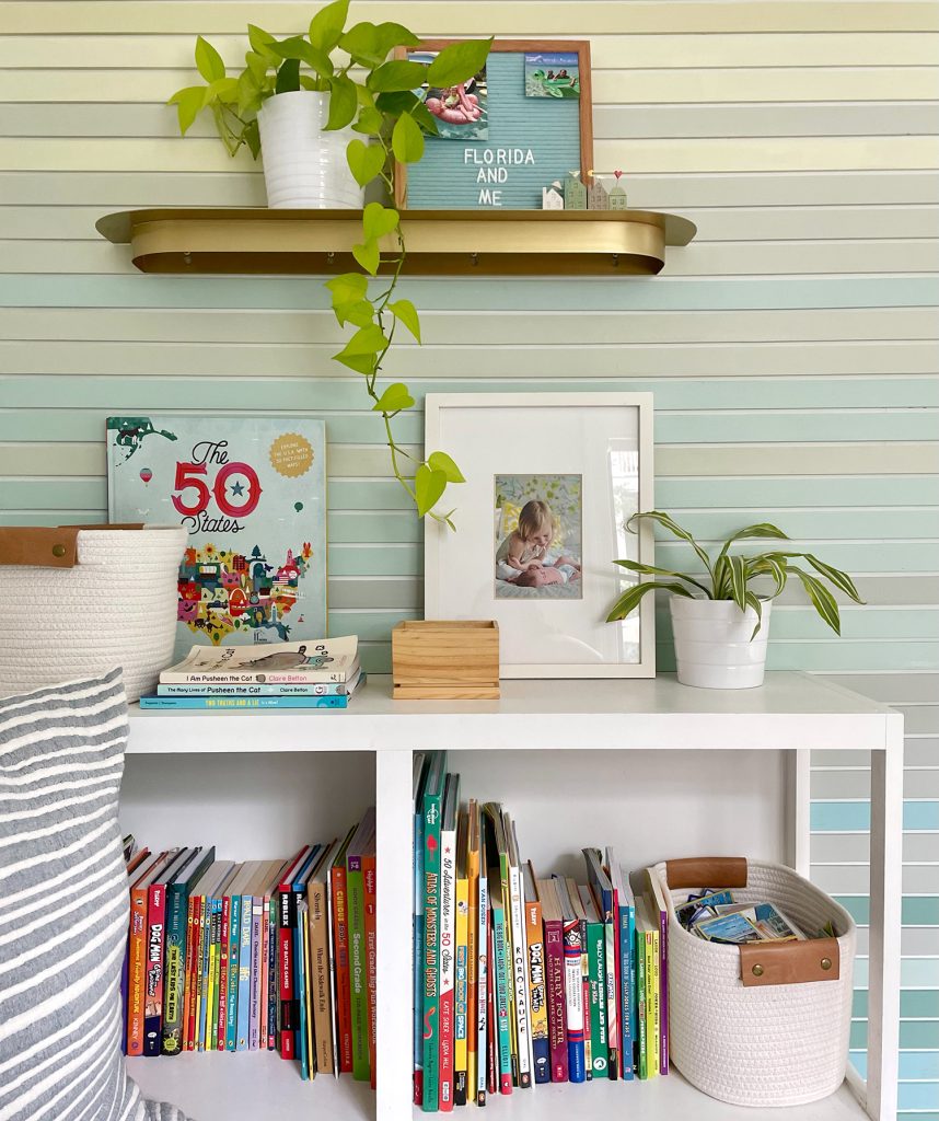 Shelf Detail Of Built In Bookcase Full Of Books And Toys