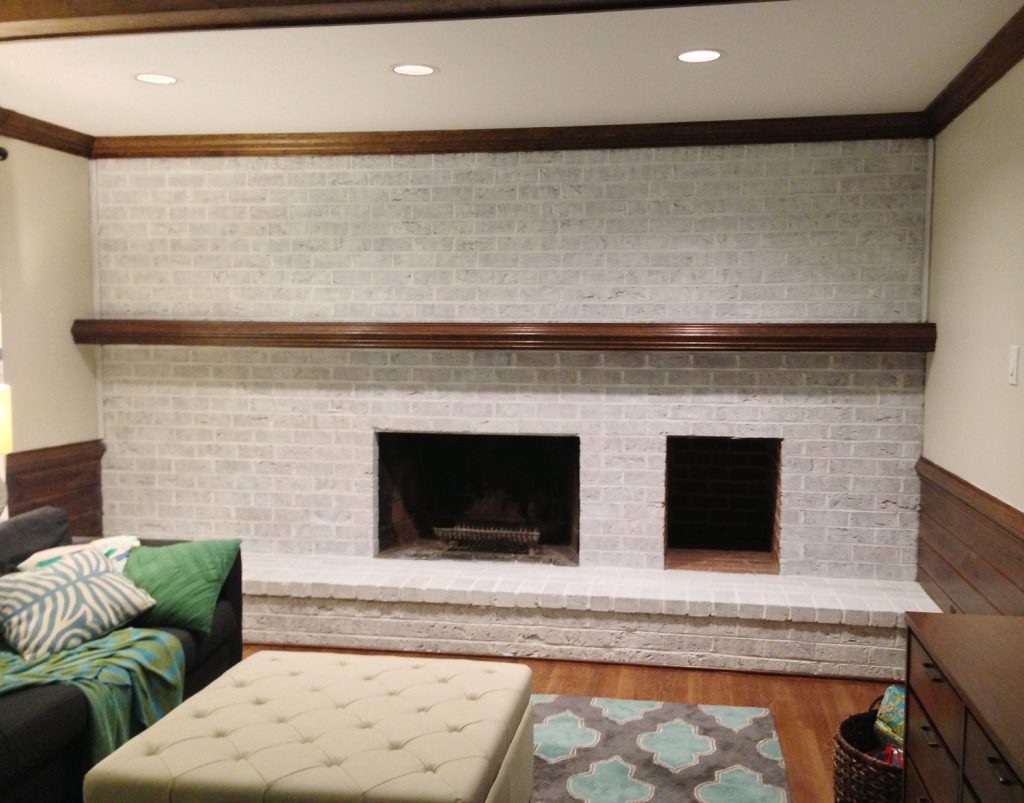 darker whitewash technique on brick wall fireplace using two coats of watered down white paint