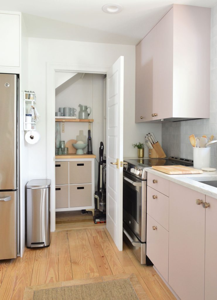 Small Utility Closet Organized With Cube Storage And Open Shelving