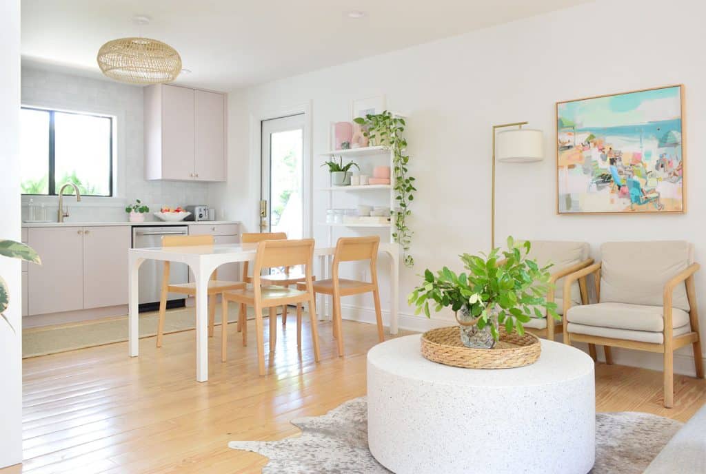 Seating Area With Round Coffee Table Next To Mauve Ikea Kitchen