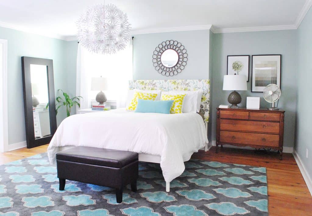 Blue bedroom with patterned DIY upholstered floral headboard