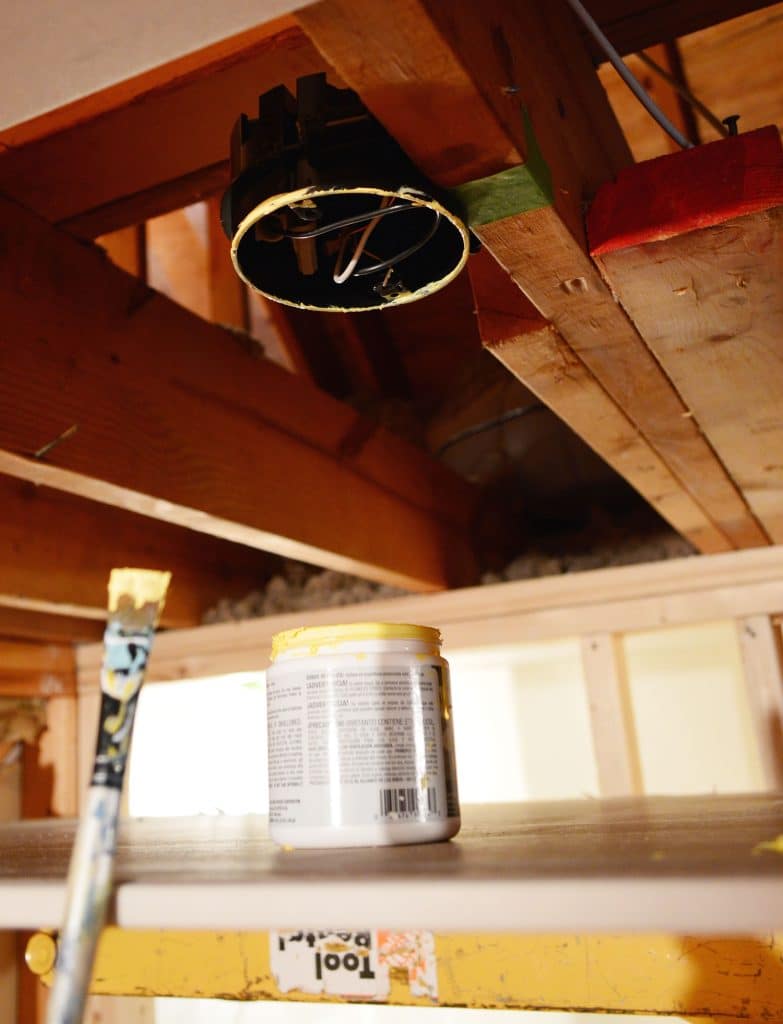 light fixture box in ceiling marked with yellow paint