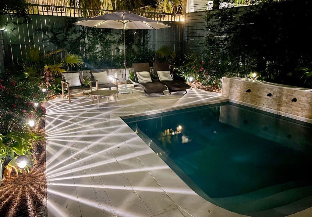 Backyard Pool Illuminated with LED Solar Pathway Lights