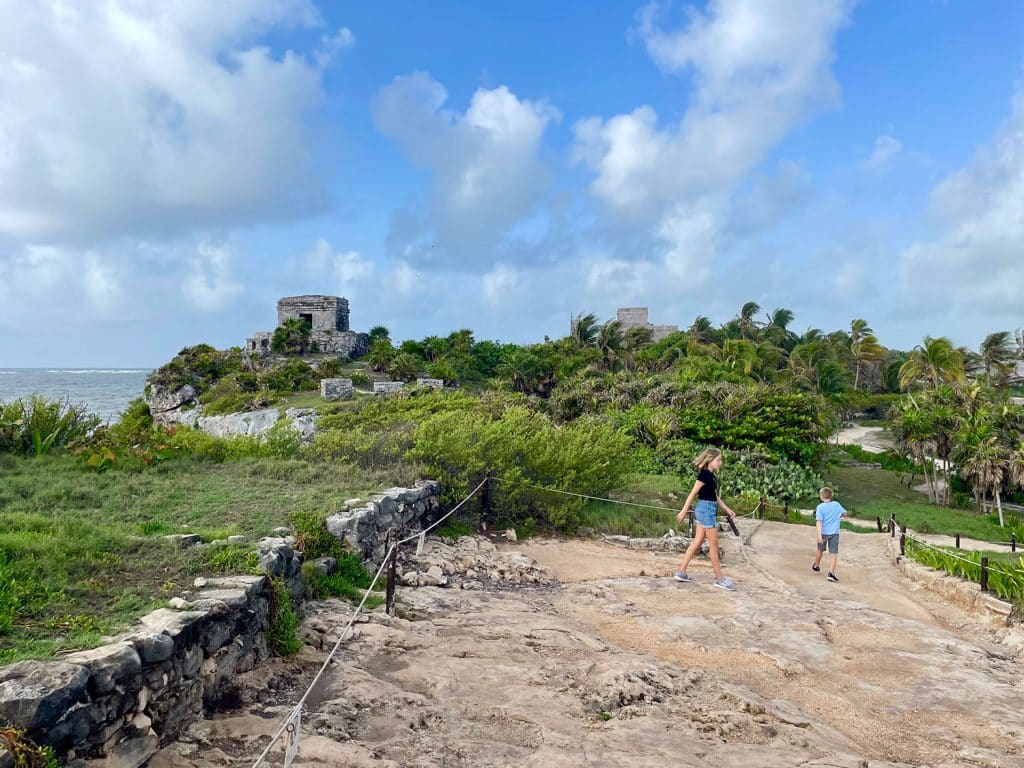 Kids Walking At Tulum Ruins In Mexico