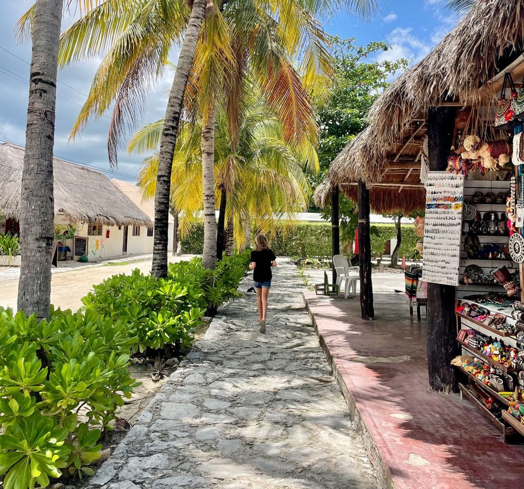 Kid Running Through Shopping in Akumal Mexico