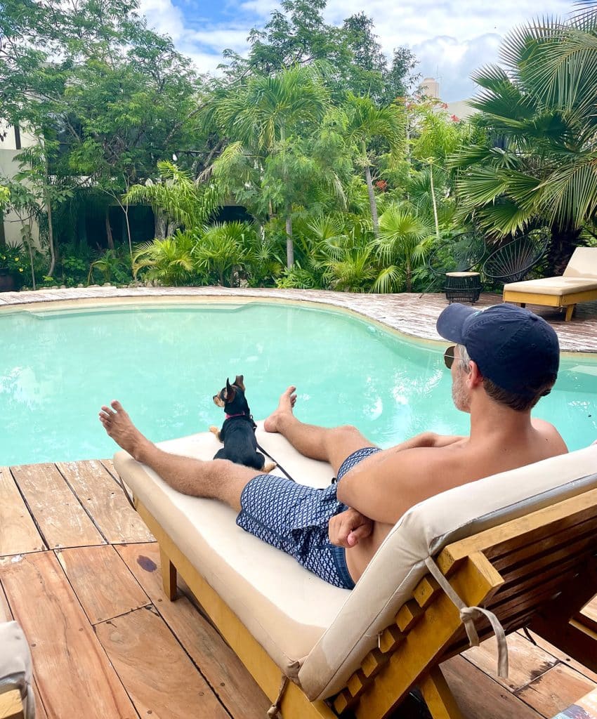 John Sitting By Pool In Akumal With Penny The Dog