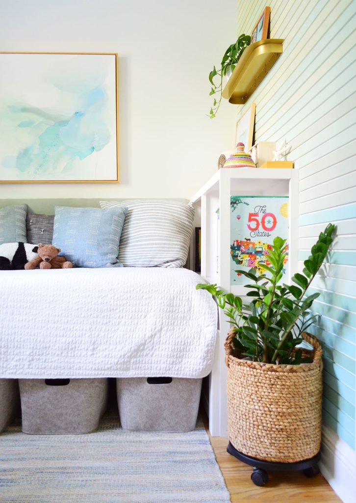 Boys Bedroom With Colorful Wood Wall Treatment And Blue Rug