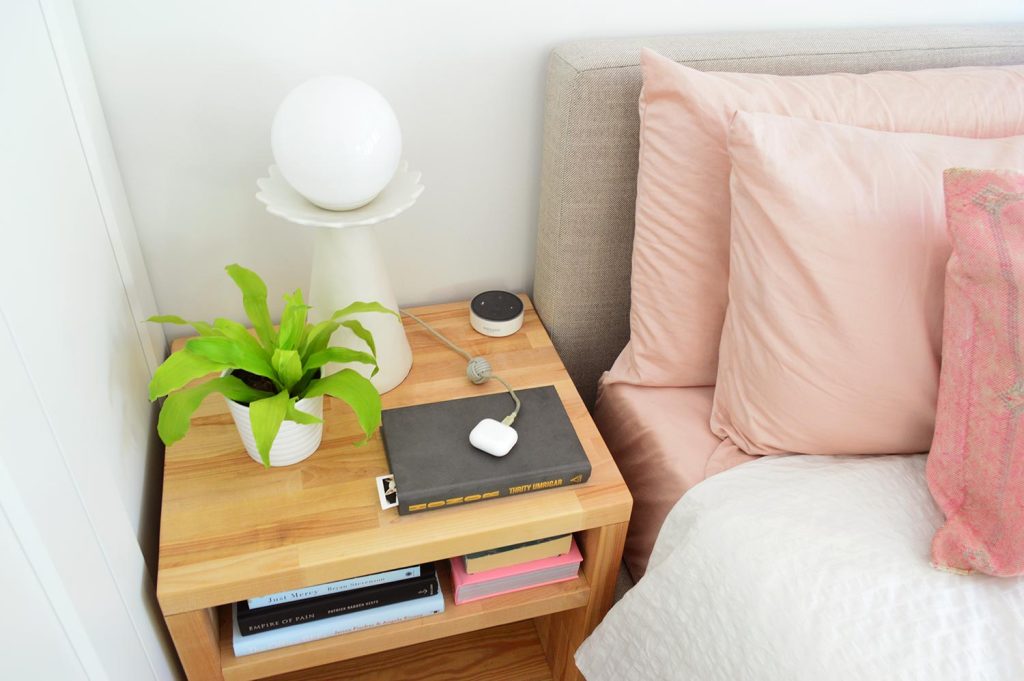 View Of Top Of Butcher Block Nightstand With Modern Lamp