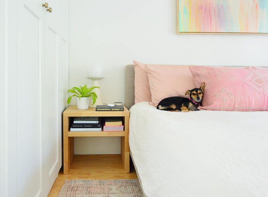 Wood Butcher Block DIY Nightstand Next To Bed With Penny The Chorkie Sleeping On Pink PIllow