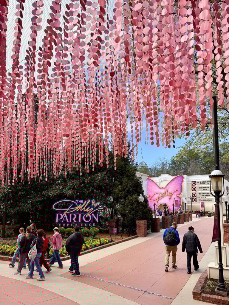 Dollywood Theme Park With Pink Art Installation Overhead