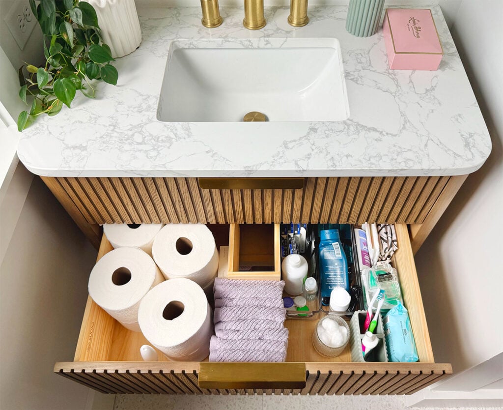 Open Bathroom Sink Vanity Drawer Showing Toiletry Organization
