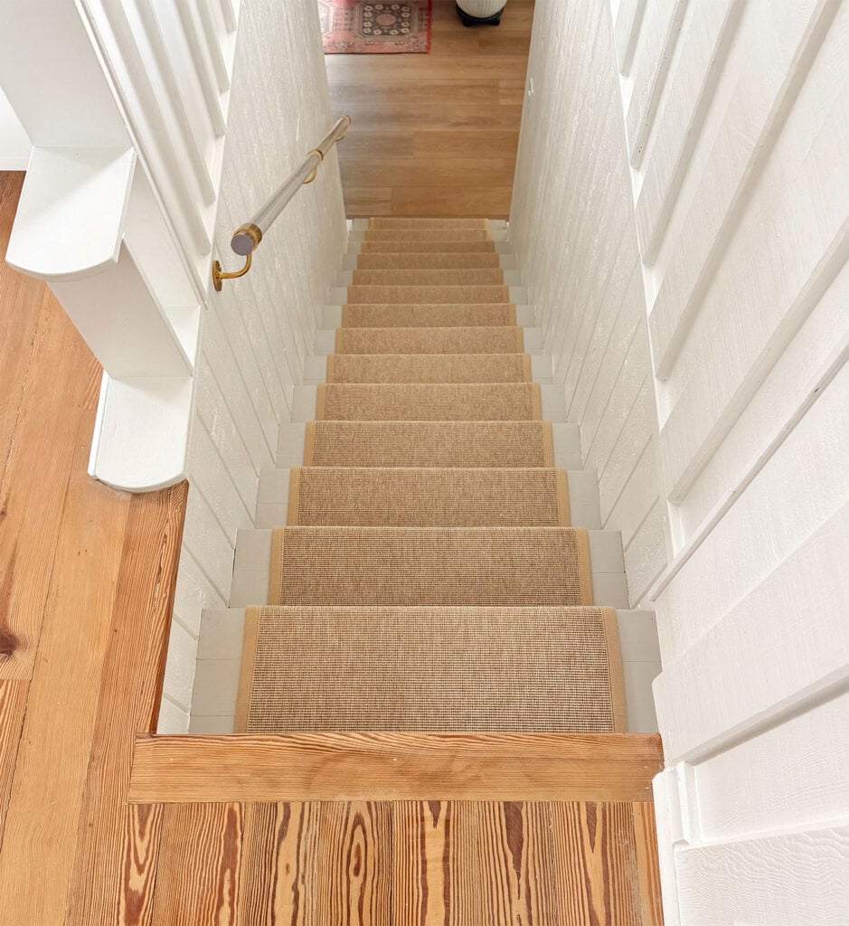View of Upstairs and Downstairs Floors Down Staircase with Sisal Runner