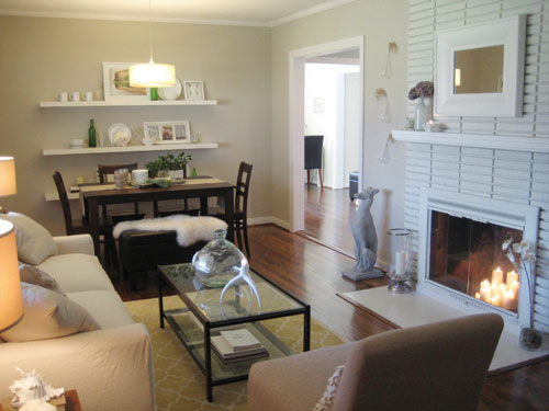 Living Room In First House With Cream Walls And Painted Brick Fireplace